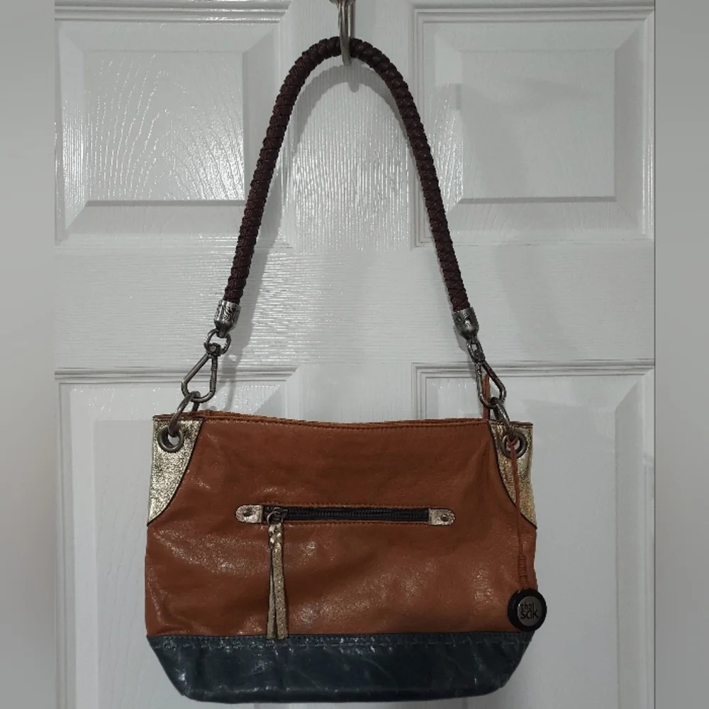 the Sak Denim Blue Natural Tan Metallic Gold Shoulder Leather Purse